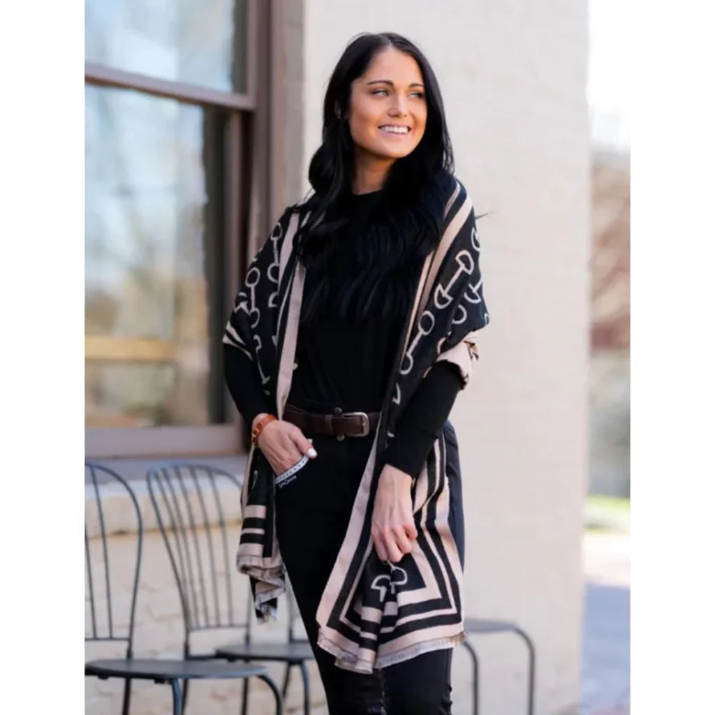 woman wearing black and tan shawl with stirrup pattern