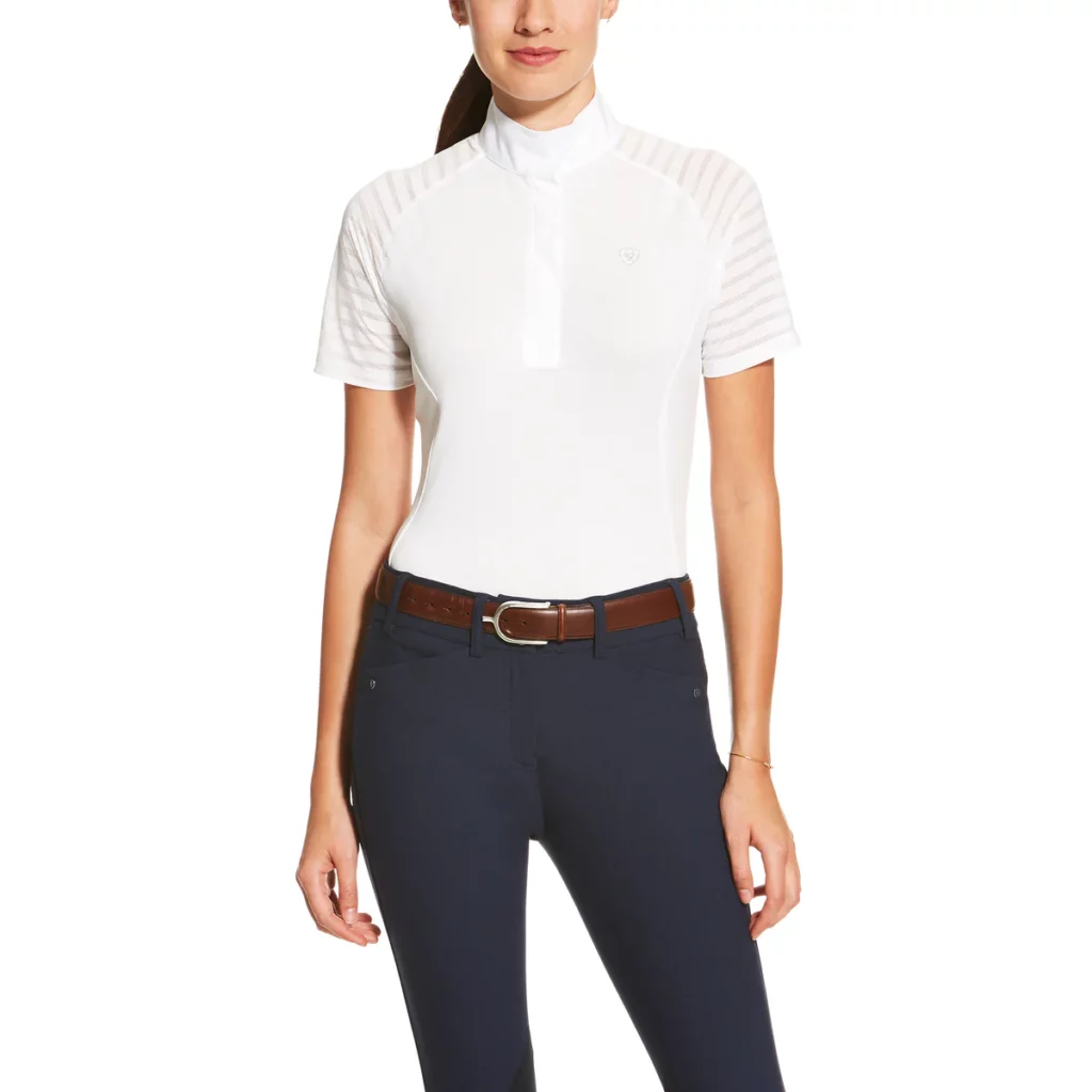Woman wearing short-sleeve, white Aptos Vent show shirt with dark breeches