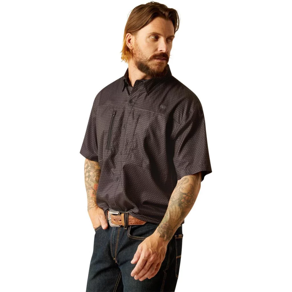 Man wearing black patterned short sleeve shirt